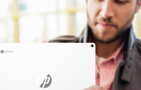 A man holding a laptop
